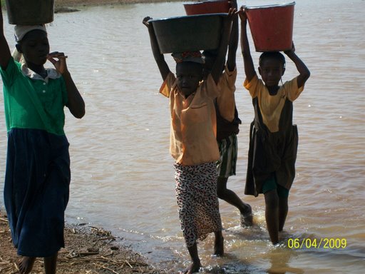 Children carrying drinking water