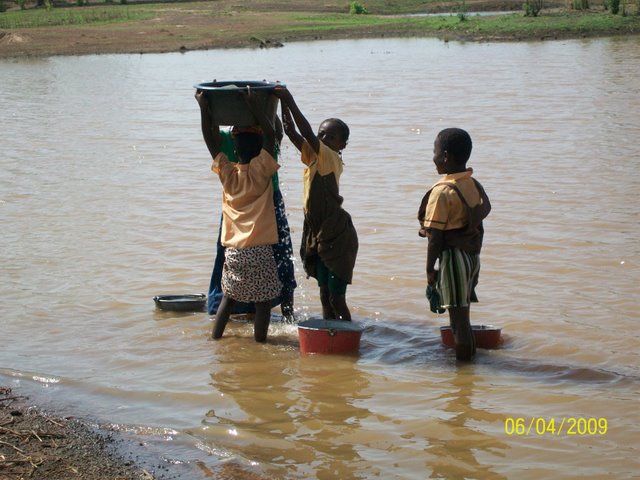 children getting water